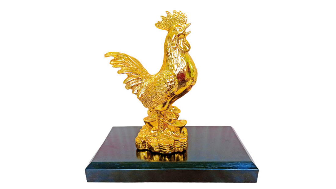 Golden feng shui chicken mascot 