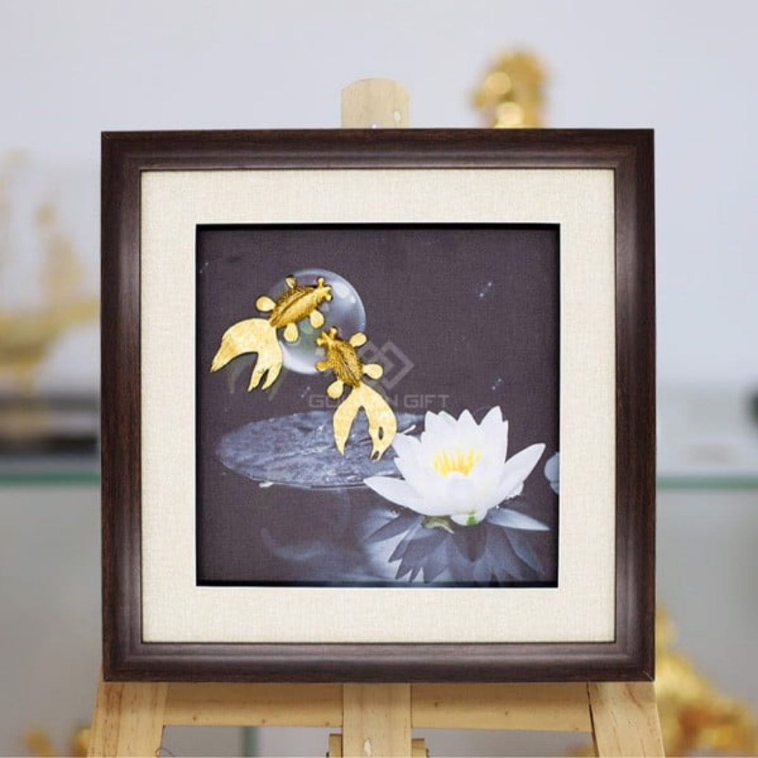 Pair of gold-plated fish playing with the moon