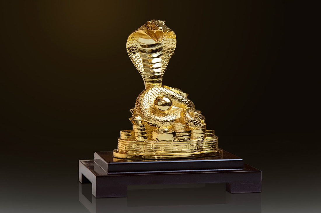 Golden feng shui snake statue